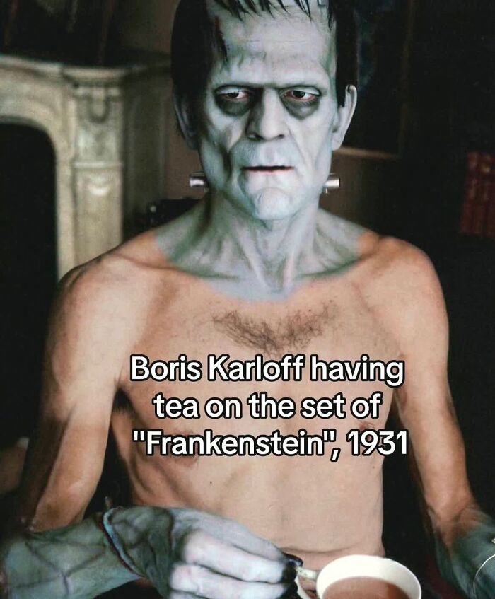 Boris Karloff in iconic Frankenstein makeup having tea on set, capturing monumental life moments frozen in time.