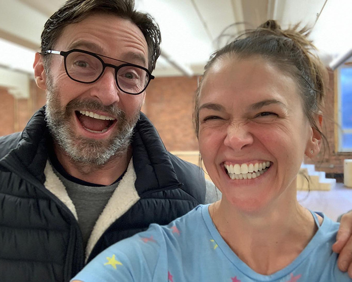 Hugh Jackman and Sutton Foster smiling closely together in a casual setting, reflecting romance and relationship challenges. Hugh Jackman and Sutton Foster smiling closely together in a casual setting, reflecting romance and relationship challenges.