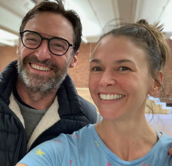 Deborra-Lee Furness and Hugh Jackman smiling together in a casual setting amid news of divorce and journey of betrayal.