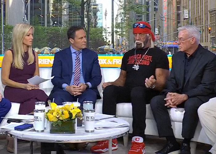 Hulk Hogan wearing red bandana and sneakers during a TV interview discussing his troubling new look at 71.