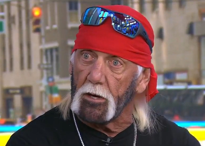 Hulk Hogan with a red bandana and reflective sunglasses on his head showing a troubling new look at 71 years old.