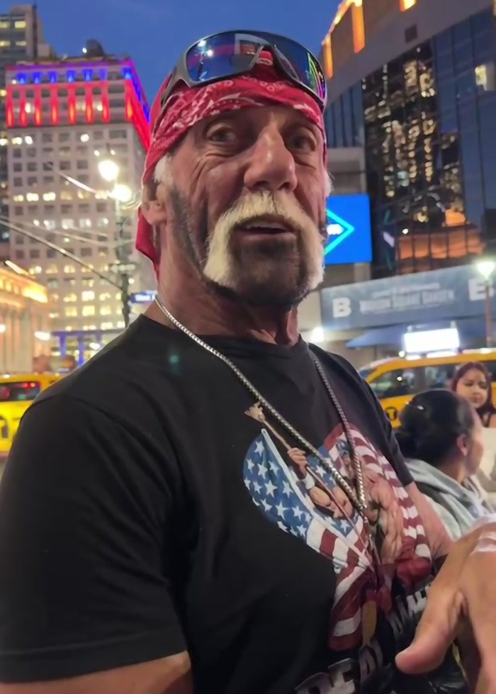 Hulk Hogan at night in a bandana and sunglasses, showing his new look with a distinctive mustache and beard style
