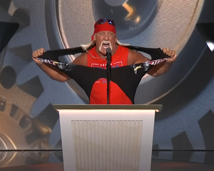 Hulk Hogan at 71, wearing a red bandana and shirt, showing a new look that raises eyebrows and concerns.