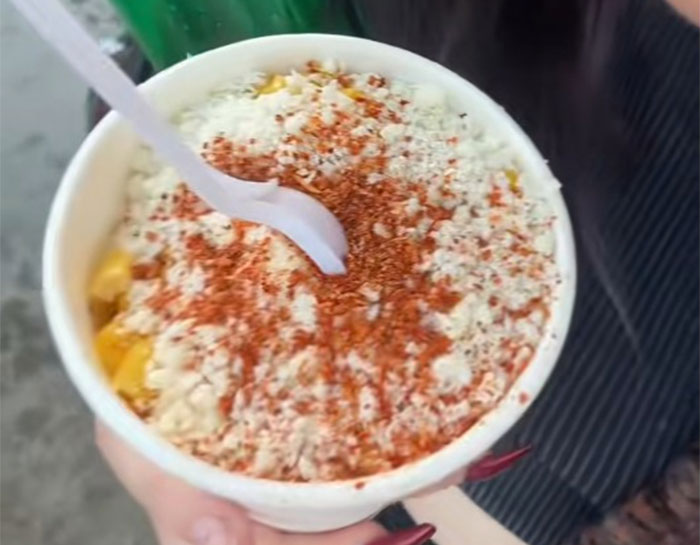 County fair foods in a cup with spicy seasoning and cheese, a bold snack that might shock a European palate.