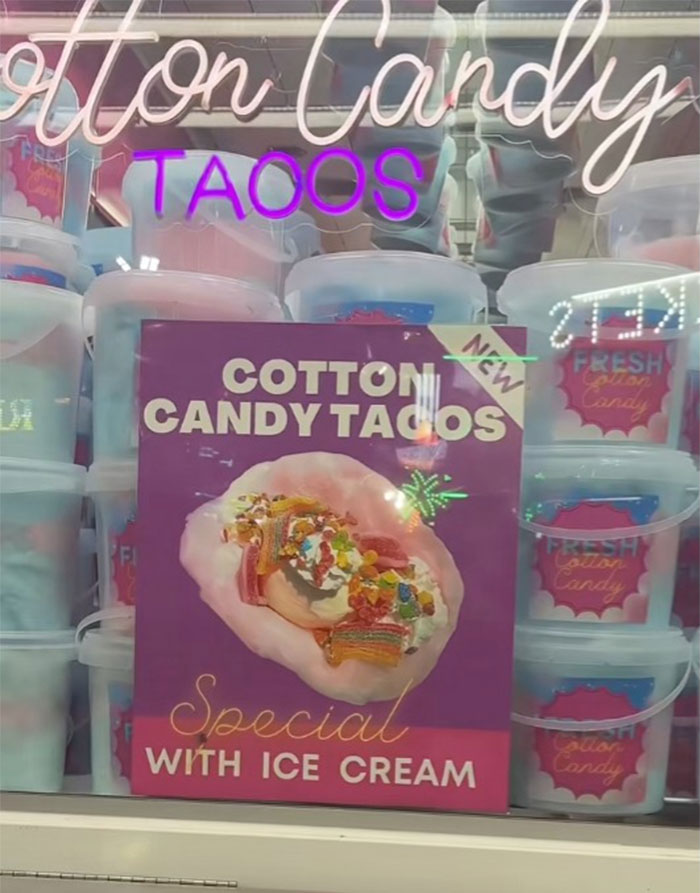 Cotton candy tacos with ice cream displayed at a county fair food stand featuring unique fair treats.