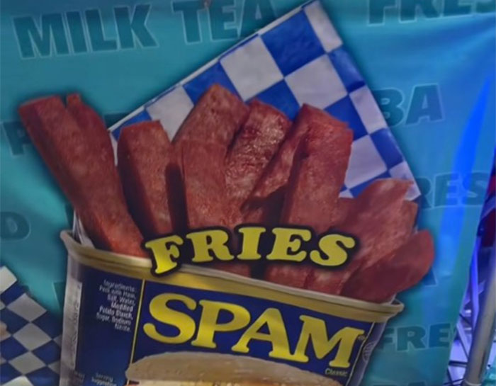 Spam fries served in a Spam can, a unique county fair food known for its bold and unusual flavor combinations.