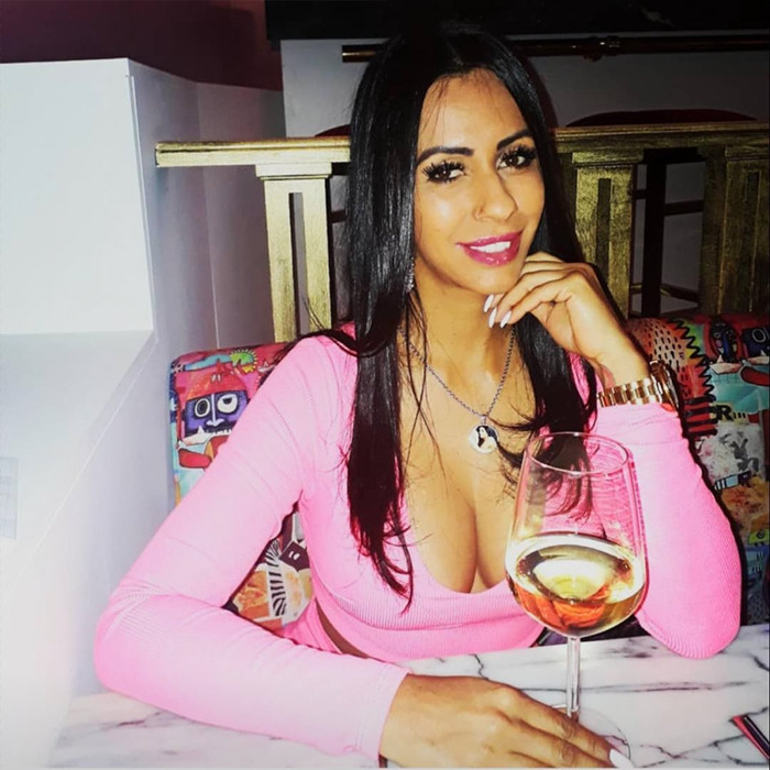 Woman sitting at a table with a glass of wine, related to a claim about Ozempic injection by boyfriend while sleeping. Woman sitting at a table with a glass of wine, related to a claim about Ozempic injection by boyfriend while sleeping.