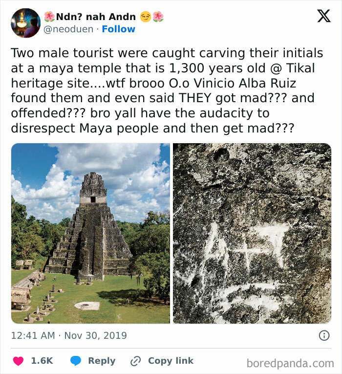 Two male tourists disrespecting Maya heritage by carving initials on a 1,300-year-old temple at Tikal heritage site.