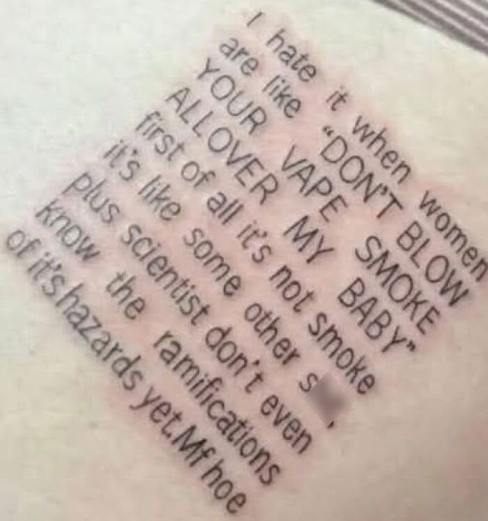 Tattoo with a long, misspelled message criticizing vape smoke, showing a permanent mistake in inked text.