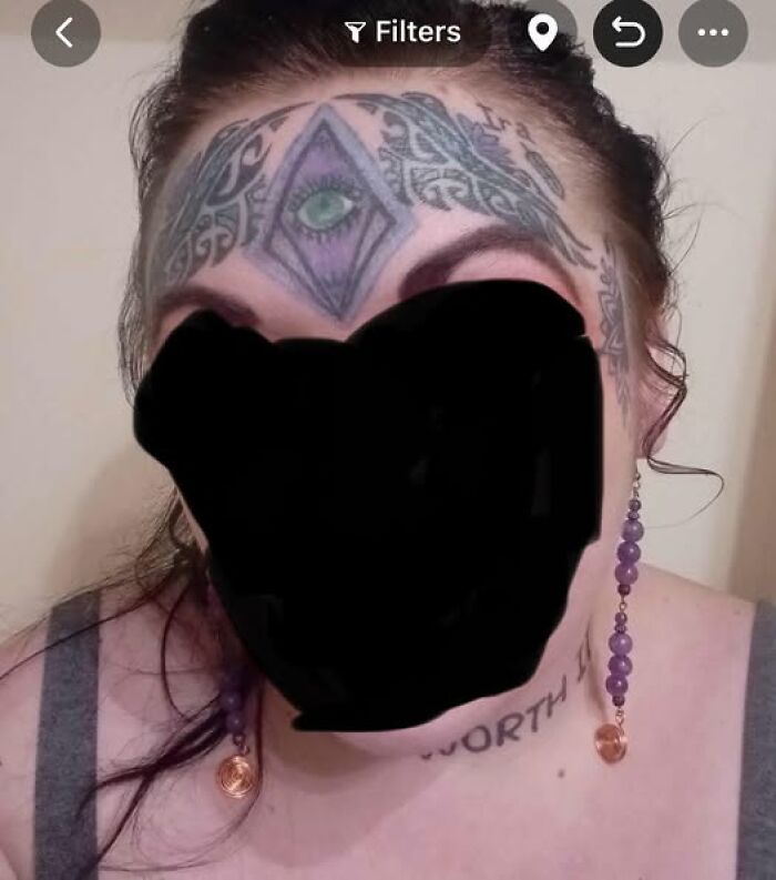 Face tattoo featuring an eye inside a diamond shape with intricate designs, an example of inked mistakes aiming to look cool.