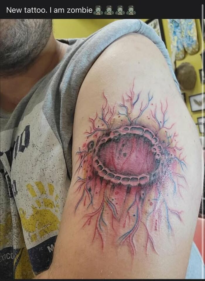 Arm tattoo of a bleeding wound with veins, showcasing one of the many people who got inked to look cool but made a permanent mistake.