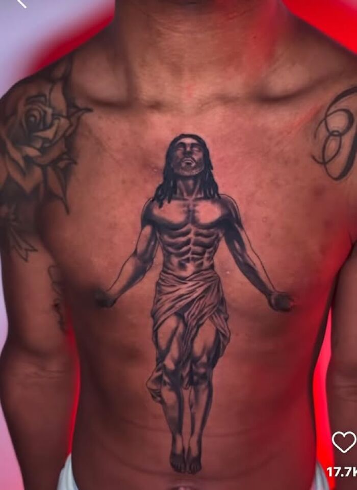 Tattoo on a man's chest depicting a muscular figure, illustrating a common inked mistake meant to look cool.