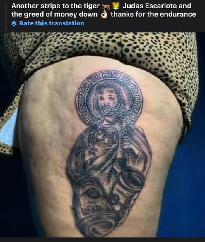 Tattoo showing a religious figure holding money rolls, an example of people getting inked to look cool but making a permanent mistake.