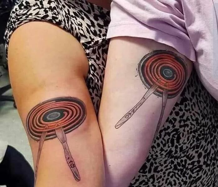 Matching pan tattoos on forearms showing a permanent inked mistake meant to look cool on skin.
