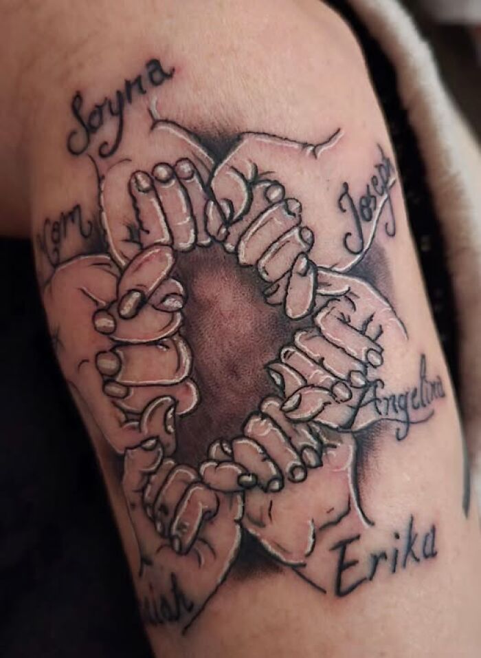 Tattoo of multiple hands linked in a circle with names around, an example of inked designs with permanent mistakes.
