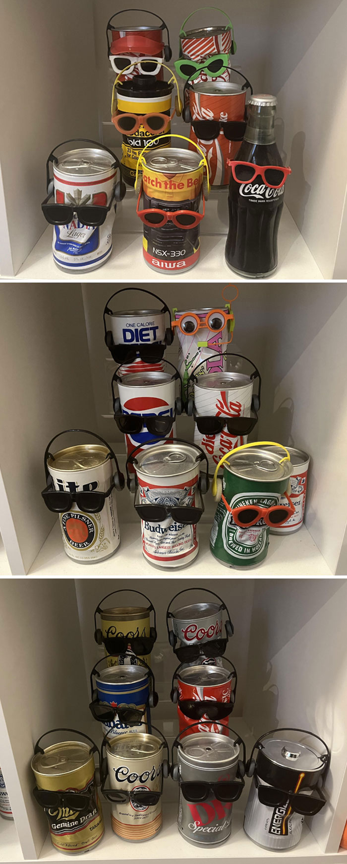 Collection of soda and beer cans wearing sunglasses and headphones as part of an unusual home collection display.