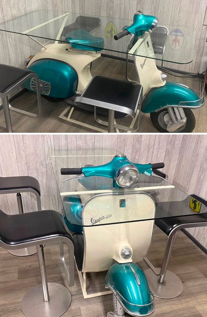 Vintage scooter repurposed as a glass dining table with modern chairs in a quirky interior design decision.