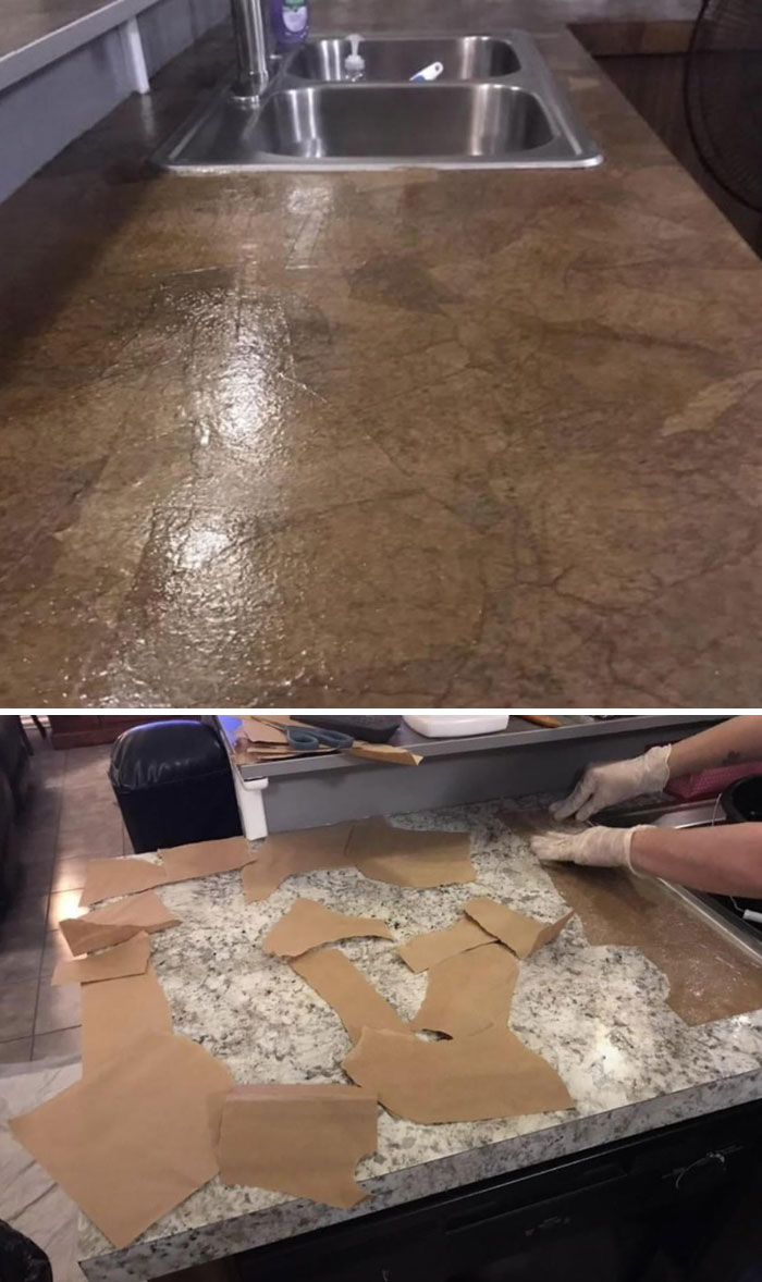 Kitchen countertop with poorly applied brown paper pieces over granite surface showing dumb interior design decisions.