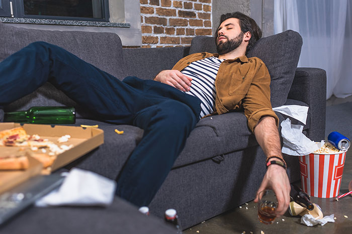 Man under the influence lying on a couch, refusing to watch kids during an emergency, sister furious about the situation. Man under the influence lying on a couch, refusing to watch kids during an emergency, sister furious about the situation.
