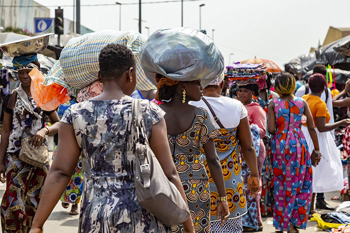 Crowd of people walking on busy street, highlighting potential changes impacting humanity in next 10 to 15 years.