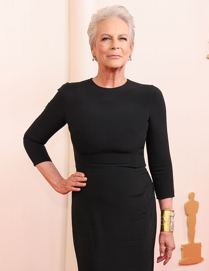 Jamie Lee Curtis posing in a black dress, recalling plastic surgery decision influenced by an embarrassing cameraman remark. Jamie Lee Curtis posing in a black dress, recalling plastic surgery decision influenced by an embarrassing cameraman remark.