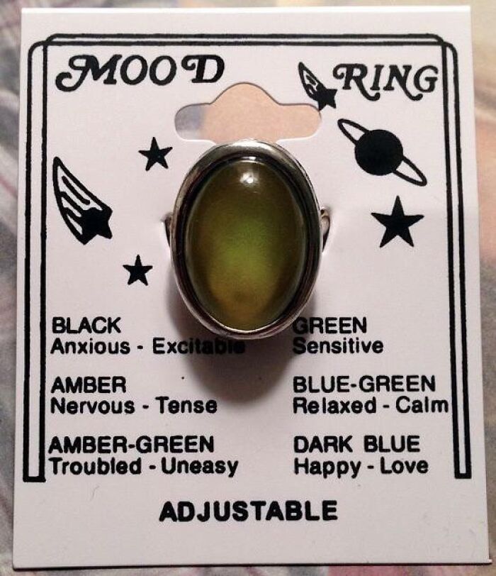 Mood ring on original 90s packaging showing color meanings, a classic cringey nineties fashion accessory left behind.