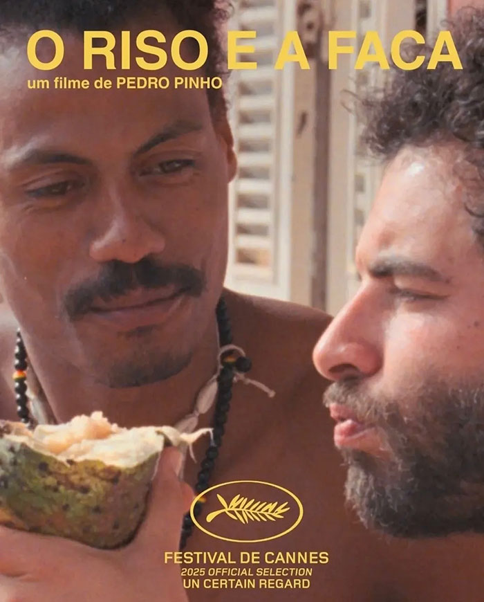 Two men sharing a moment with fruit, promoting a Cannes film, highlighting star reveals backside at Festival de Cannes.