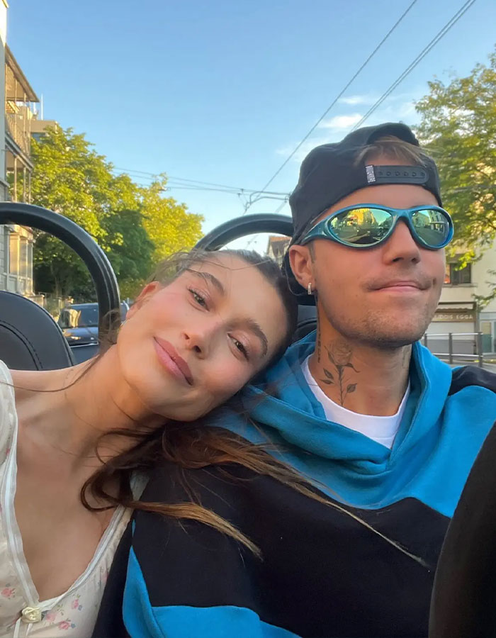 Justin Bieber and a woman sitting close in a car, showcasing chemistry that raises eyebrows among fans. Justin Bieber and a woman sitting close in a car, showcasing chemistry that raises eyebrows among fans.