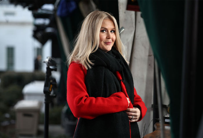 Karoline Leavitt smiling outdoors in winter attire, related to Nicholas Riccio and her husband information.