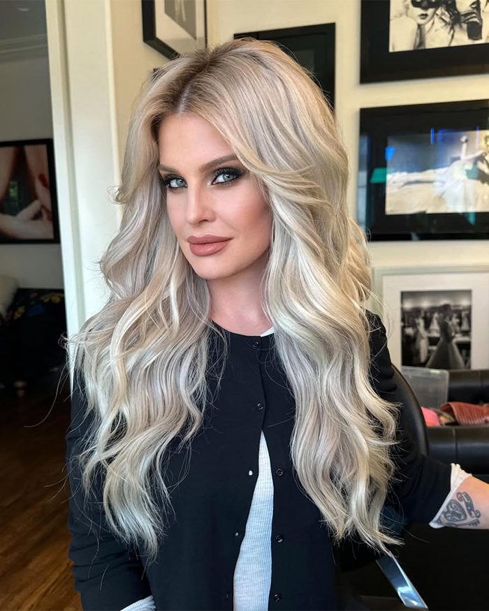 Kelly Osbourne with long blonde hair and makeup, showcasing her stunning transformation amid Ozempic and plastic surgery rumors.