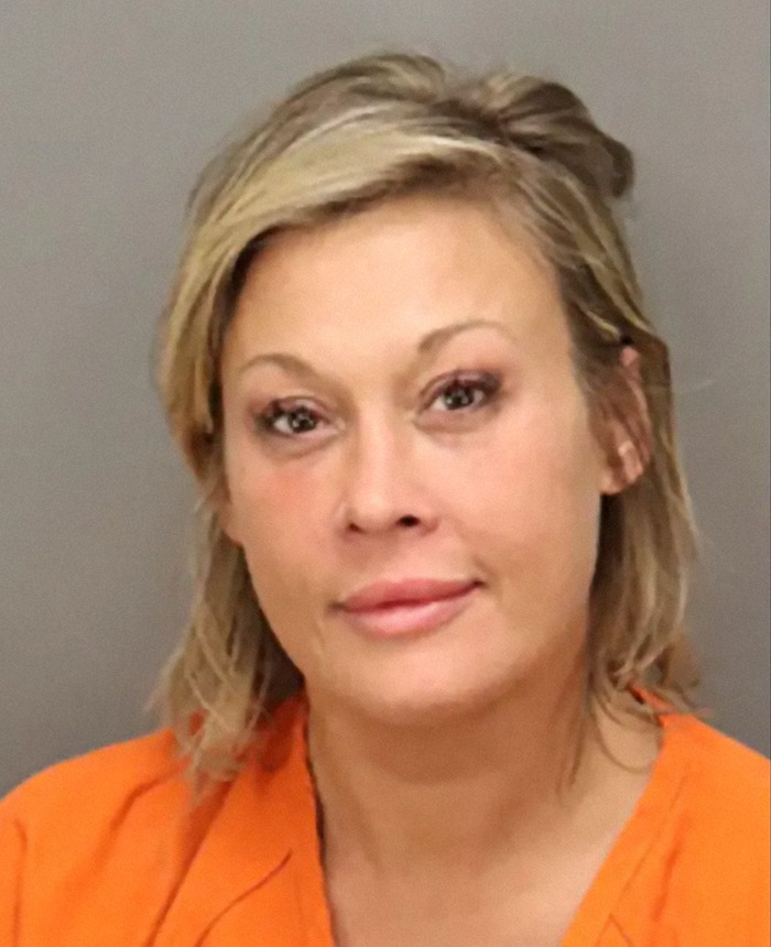 Woman in an orange prison jumpsuit posing for a mugshot related to man wins $167 million lottery arrest story Woman in an orange prison jumpsuit posing for a mugshot related to man wins $167 million lottery arrest story