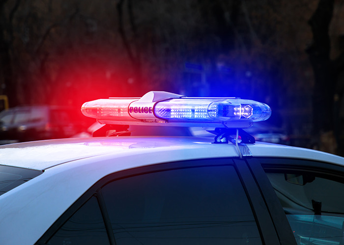 Police car with red and blue emergency lights flashing, related to man winning $167 million lottery and arrest news. Police car with red and blue emergency lights flashing, related to man winning $167 million lottery and arrest news.