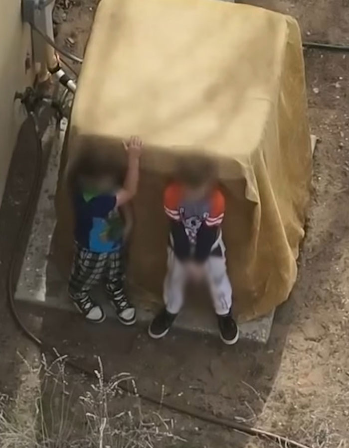 Two little boys in Minecraft and Star Wars pajamas standing near a covered object, refusing to drop a weapon. Two little boys in Minecraft and Star Wars pajamas standing near a covered object, refusing to drop a weapon.