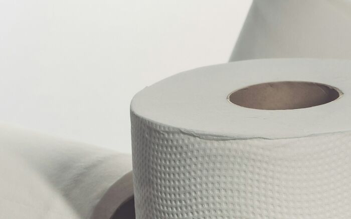 Close-up of a roll of paper towels with textured surface, illustrating a useful life hack for common household tasks.