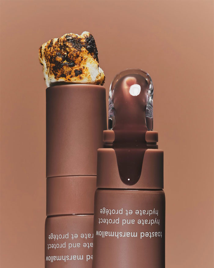 Toasted marshmallow flavored lip balm stick and tube, highlighting Kylie Jenner&rsquo;s net worth and luxury lifestyle keywords.