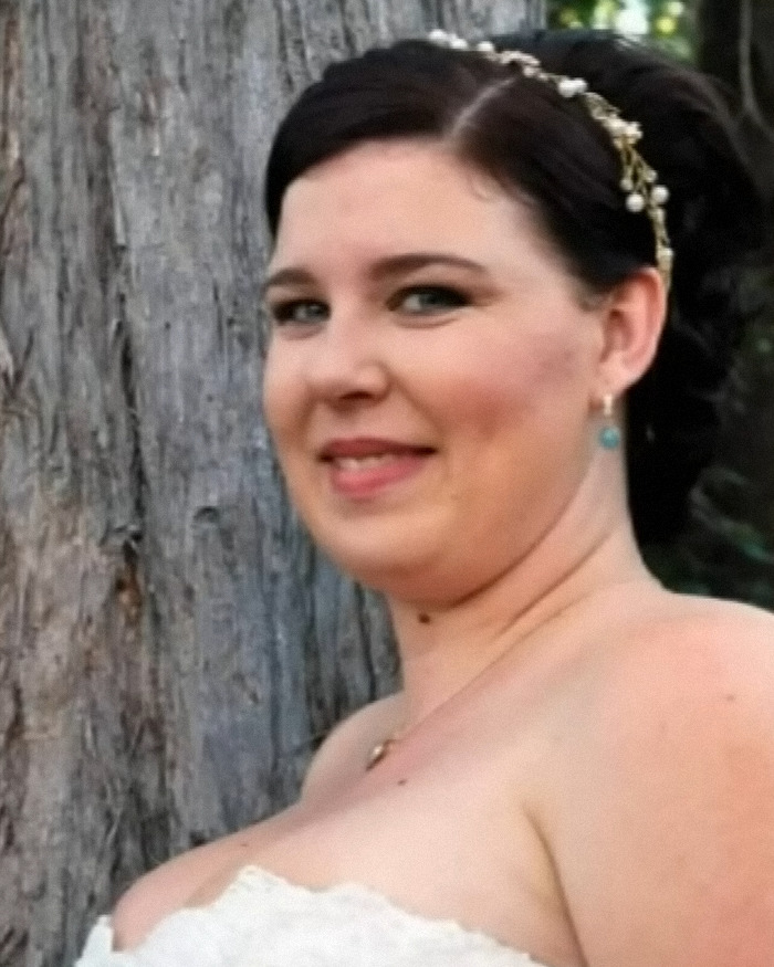 Woman in a white dress smiling near a tree, related to leaked messages about Phoebe Bishop's flatmate after teen&rsquo;s disappearance