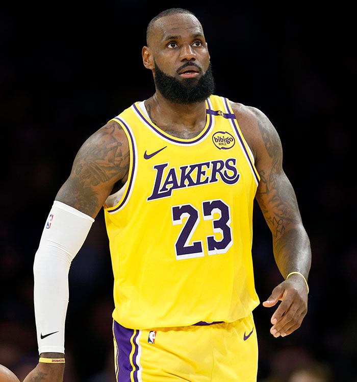 NBA player wearing yellow Lakers jersey with number 23, unrelated to Met Gala 2025's most uncomfortable moments.
