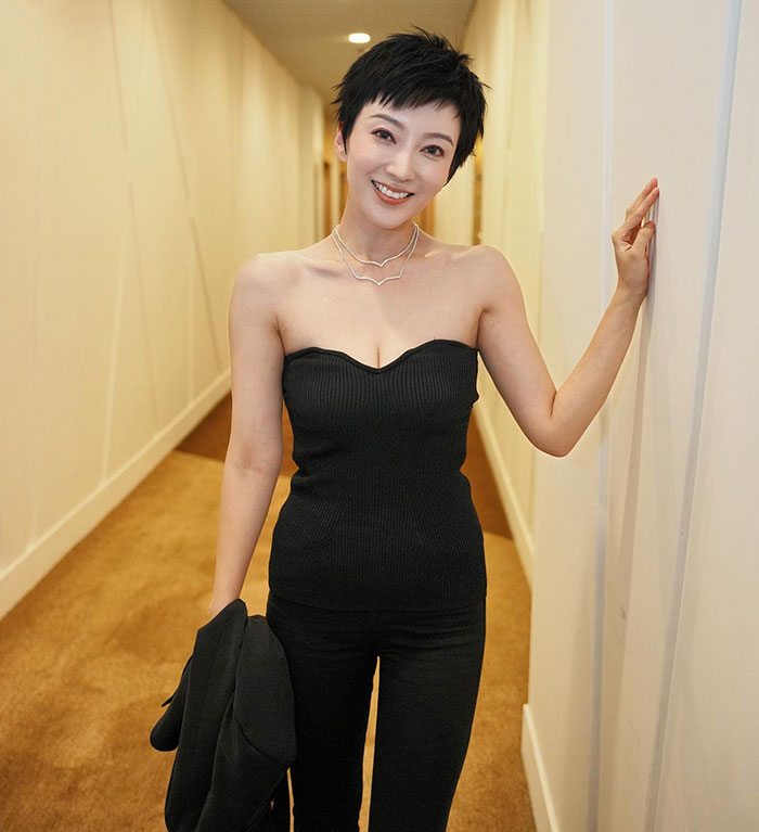 Woman in black outfit smiling and standing in a hallway highlighting a monster mom story involving a 4YO child’s difficult routine. Woman in black outfit smiling and standing in a hallway highlighting a monster mom story involving a 4YO child’s difficult routine.