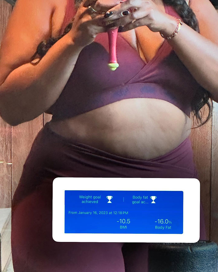 Lizzo showing off her body in workout clothes after hitting weight loss and body fat goals, holding a phone. Lizzo showing off her body in workout clothes after hitting weight loss and body fat goals, holding a phone.