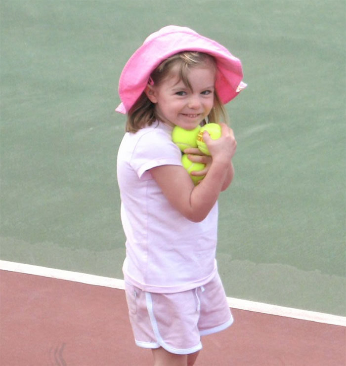 Young girl in pink hat and shorts holding tennis balls, representing Madeleine McCann suspect disturbing moment smirk.