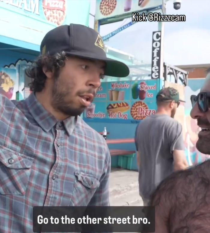 Man confronts creepy influencer secretly filming woman with smart glasses near a colorful food stand outdoors. Man confronts creepy influencer secretly filming woman with smart glasses near a colorful food stand outdoors.