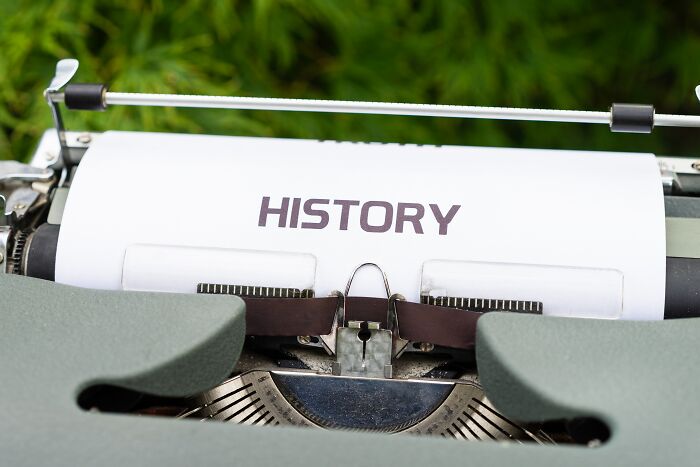 Vintage typewriter typing the word history on white paper, reflecting Gen X having the best of both worlds.