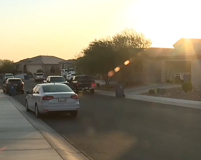 Suburban street at sunset with parked cars and houses, related to man who left toddler in hot car marriage revelation. Suburban street at sunset with parked cars and houses, related to man who left toddler in hot car marriage revelation.
