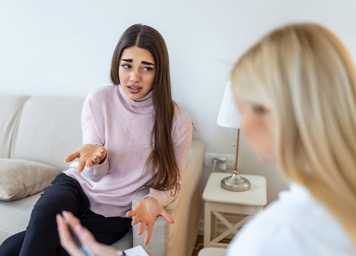 Patient upset and frustrated during a consultation highlighting hurtful things doctors said that made patients change doctors