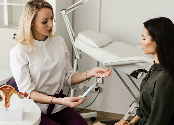 Doctor discussing medical device with patient, highlighting hurtful things doctors said that made patients want to change doctors.