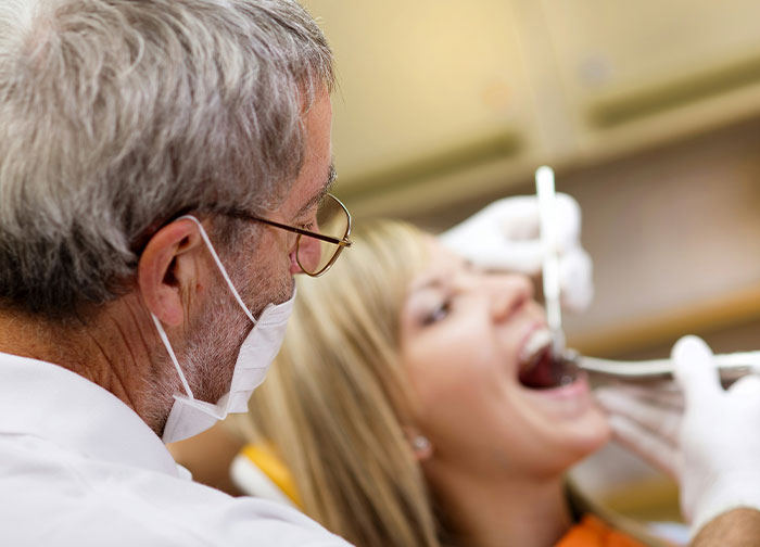 Doctor examining patient in clinic highlighting common hurtful things doctors said and did to patients.