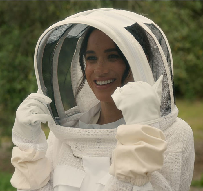 Meghan Markle in a beekeeping suit smiling outdoors, stunning fans with a rare glimpse of 3-year-old Lilibet's face. Meghan Markle in a beekeeping suit smiling outdoors, stunning fans with a rare glimpse of 3-year-old Lilibet's face.