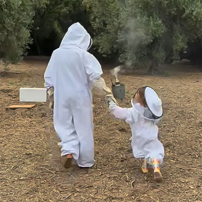 Meghan Markle and 3-year-old Lilibet in beekeeping suits walking outdoors in a stunning family moment. Meghan Markle and 3-year-old Lilibet in beekeeping suits walking outdoors in a stunning family moment.