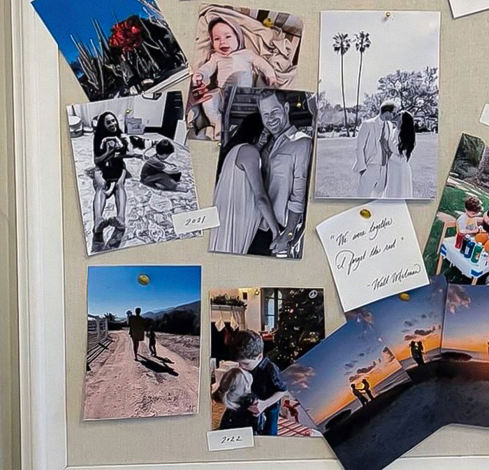 Photos of Meghan Markle and family displayed on a board, including an image showing 3-year-old Lilibet's face. Photos of Meghan Markle and family displayed on a board, including an image showing 3-year-old Lilibet's face.