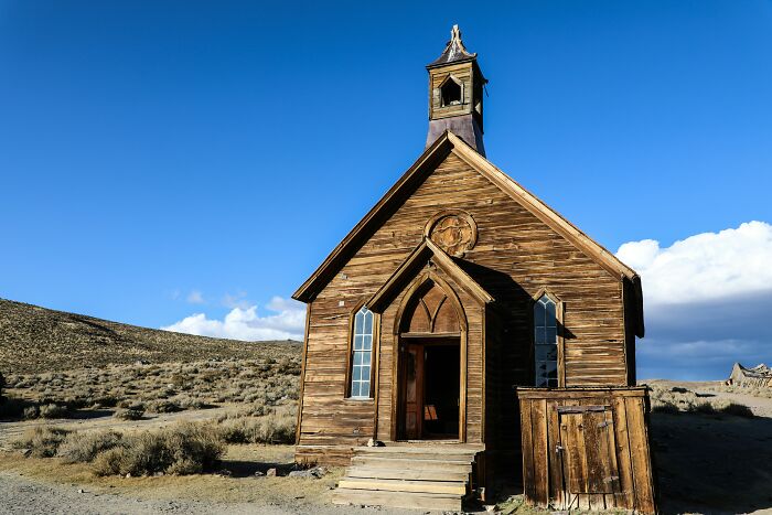 Abandoned wooden church in a deserted area representing tourist destinations that have fallen into oblivion.